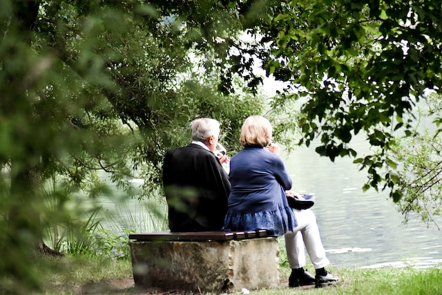 seniors sitting by the lake