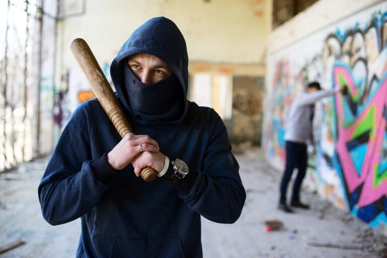 violent man holding a baseball bat